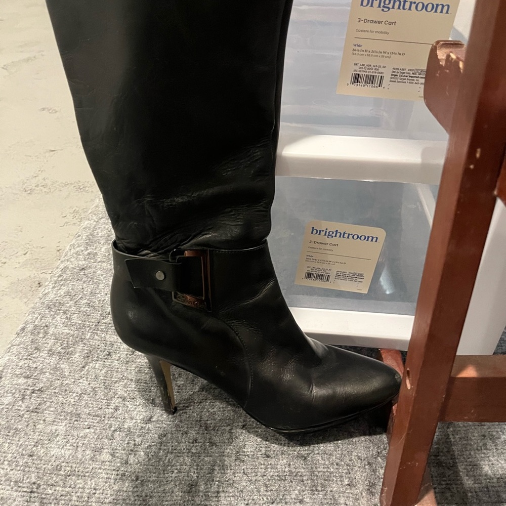 Calvin Klein size ten boots with side buckle.